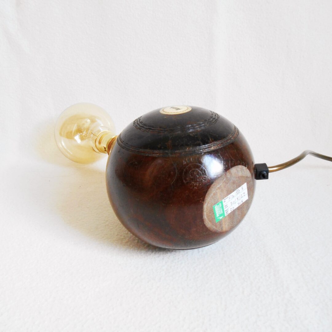 A pair of vintage wooden bowling ball lamps by Fiona Bradshaw Designs