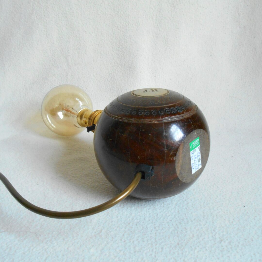 A pair of vintage wooden bowling ball lamps by Fiona Bradshaw Designs