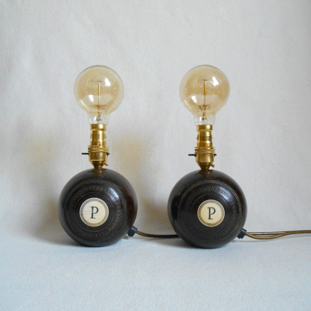 A pair of vintage wooden bowling ball lamps by Fiona Bradshaw Designs