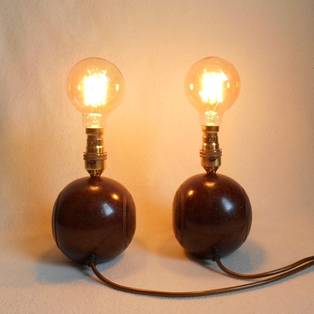 A pair of vintage wooden bowling ball lamps by Fiona Bradshaw Designs