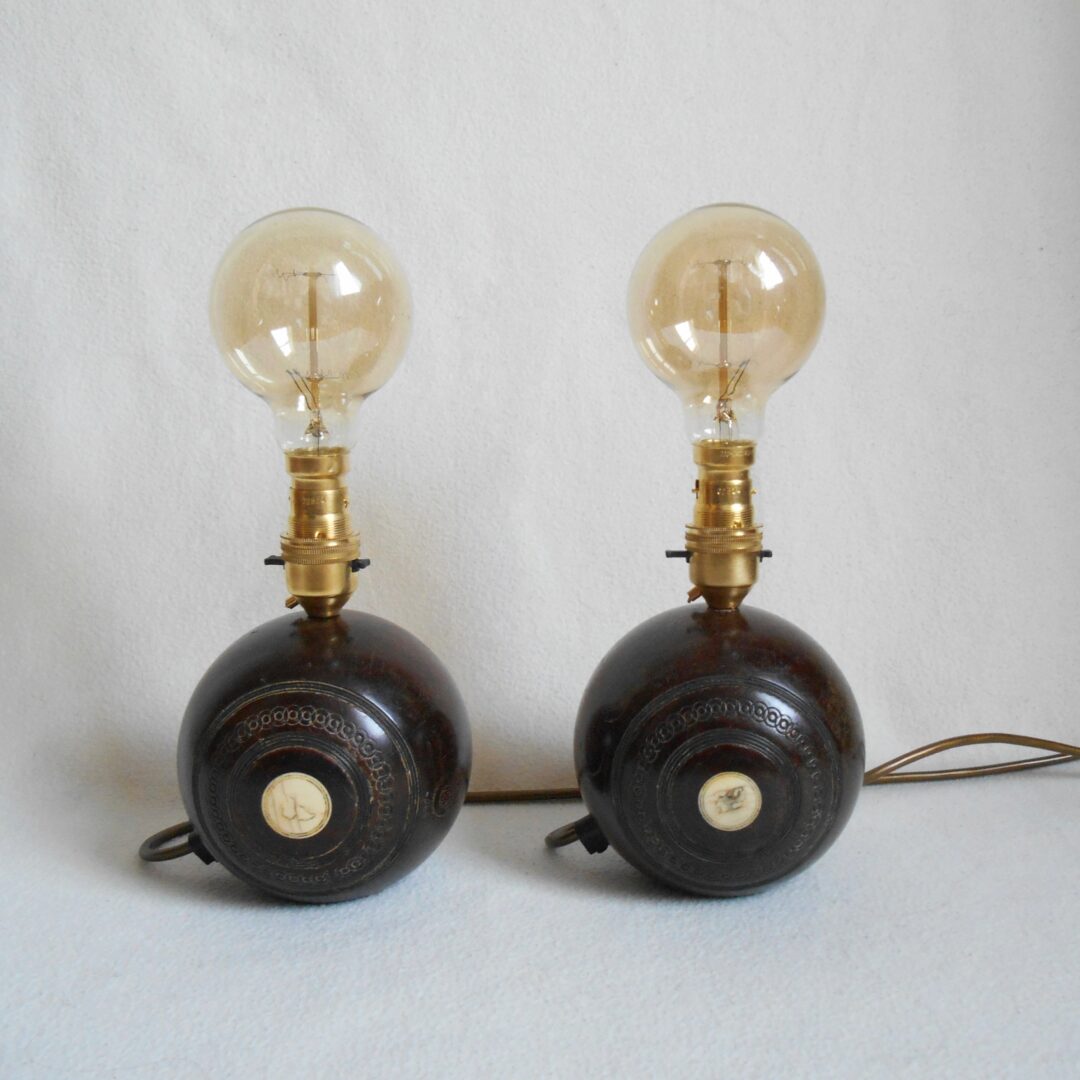 A pair of vintage wooden bowling ball lamps by Fiona Bradshaw Designs