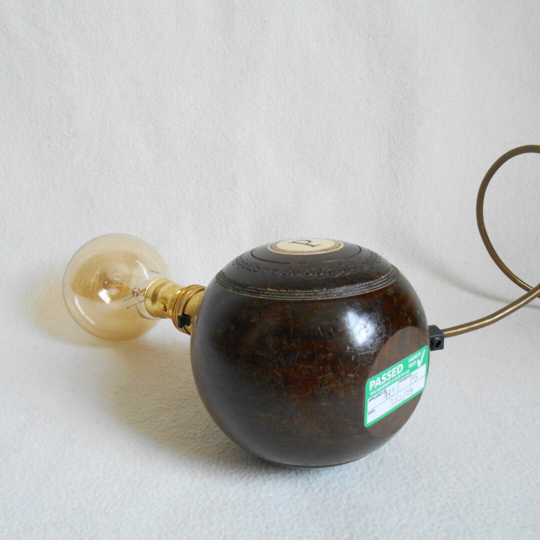 A pair of vintage wooden bowling ball lamps by Fiona Bradshaw Designs