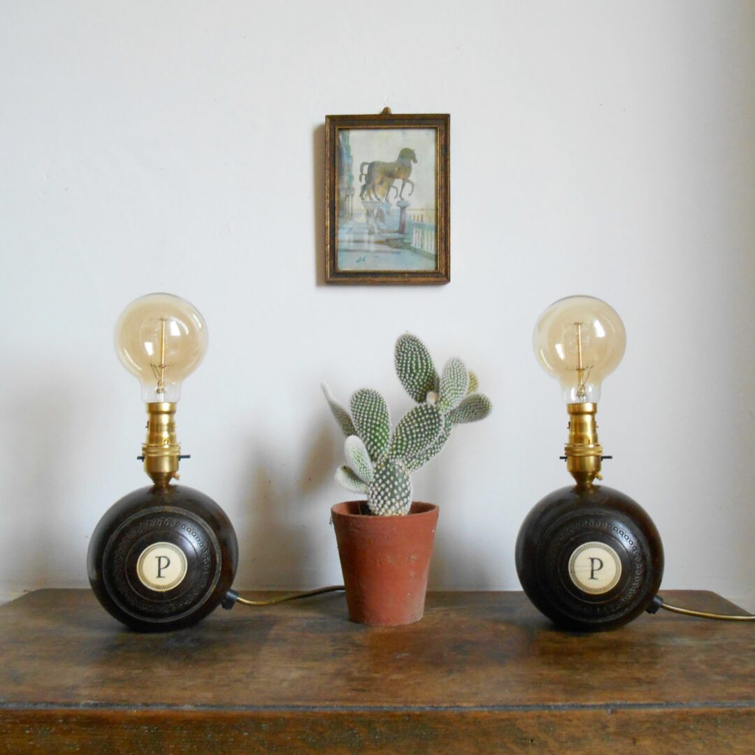 A pair of vintage wooden bowling ball lamps by Fiona Bradshaw Designs