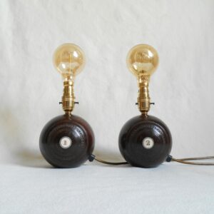 A pair of vintage wooden bowling ball lamps by Fiona Bradshaw Designs