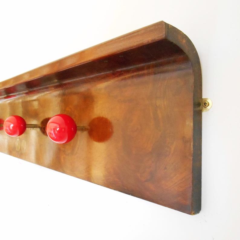 Antique coat rack made from a piano lid & red snooker balls by Fiona Bradshaw Designs