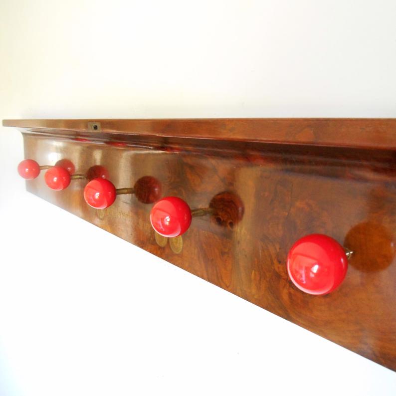 Antique coat rack made from a piano lid & red snooker balls by Fiona Bradshaw Designs