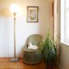 A vintage brass floor lamp with a large glass dome by Fiona Bradshaw Designs