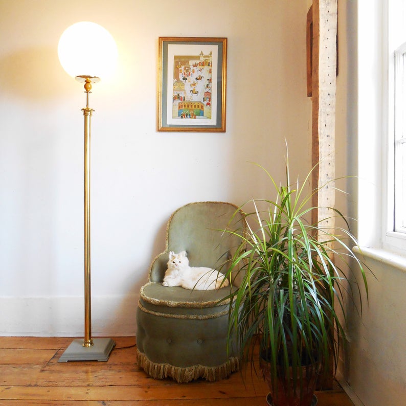 A vintage brass floor lamp with a large glass dome by Fiona Bradshaw Designs