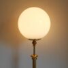 A vintage brass floor lamp with a large glass dome by Fiona Bradshaw Designs