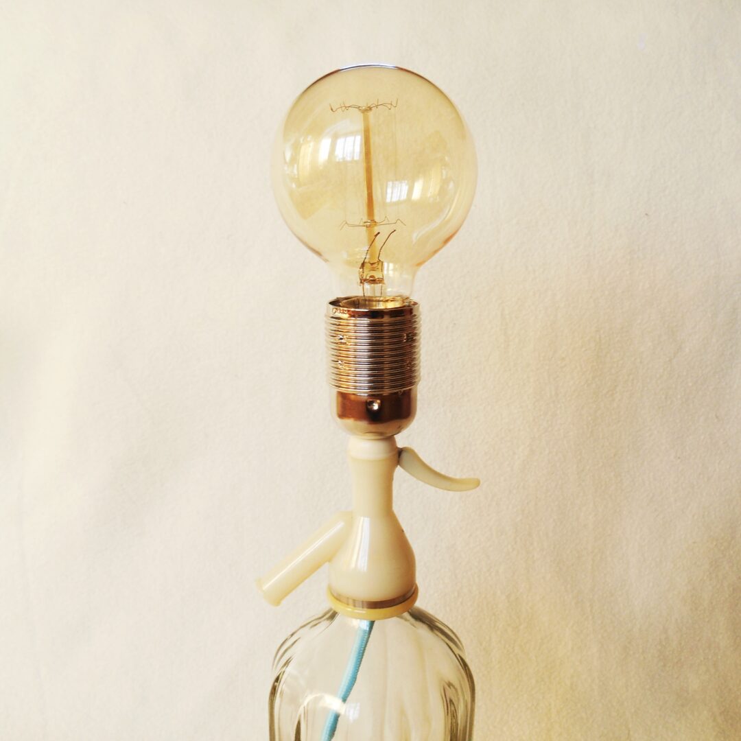 A vintage soda syphon repurposed into a unique table lamp by Fiona Bradshaw Designs
