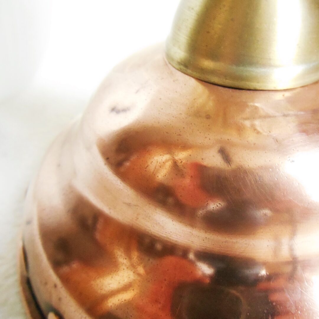 Copper dolly plunger lamp with an oval opaline shade by Fiona Bradshaw Designs
