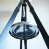 Tripod floor lamp with unique monochrome features and a glass globe shade by Fiona Bradshaw Designs