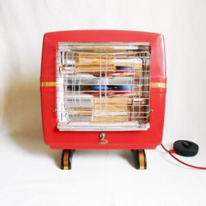 A vintage belling heater repurposed into a maroon floor lamp by Fiona Bradshaw Designs