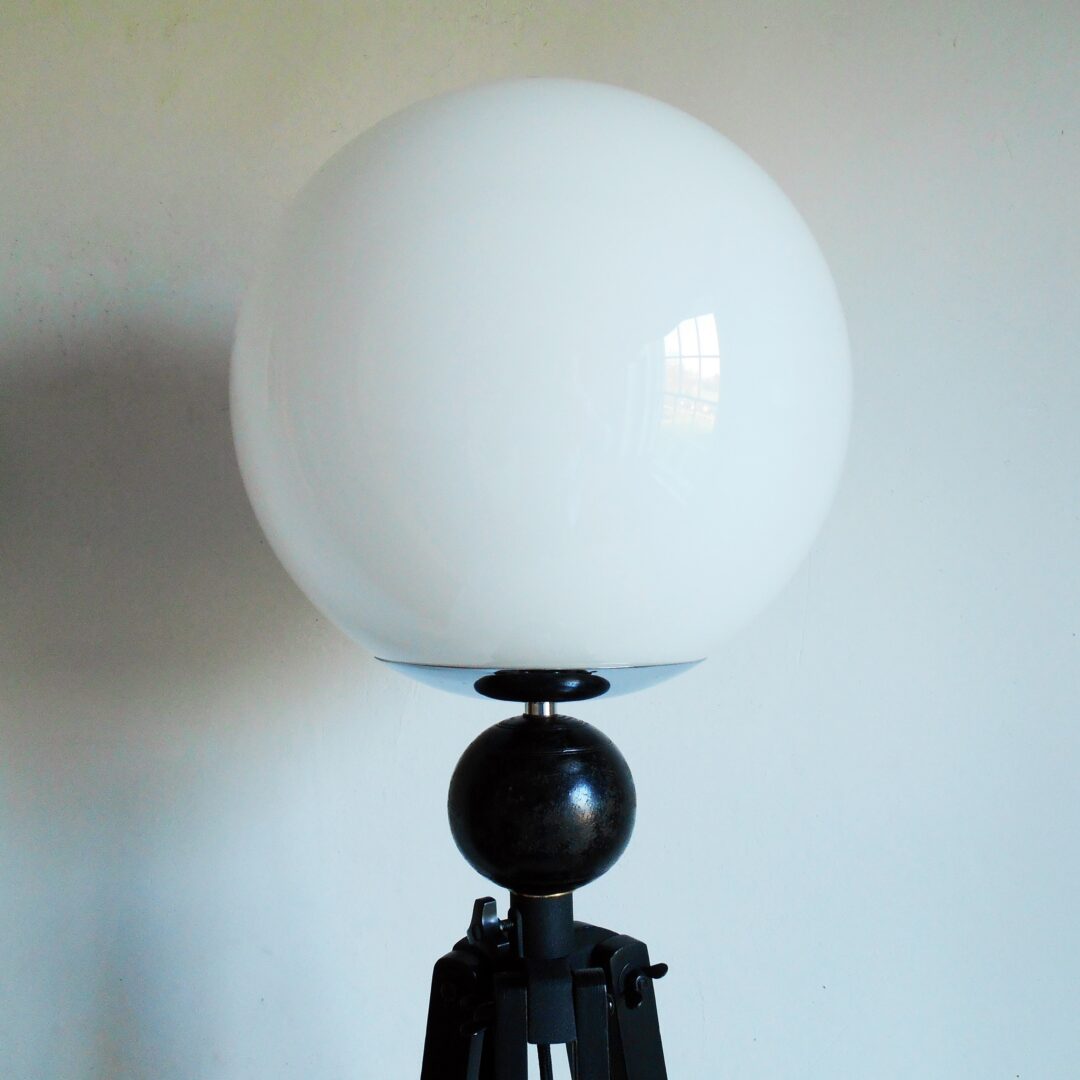 Tripod floor lamp with unique monochrome features and a glass globe shade by Fiona Bradshaw Designs