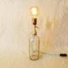 A vintage soda syphon repurposed into a unique table lamp by Fiona Bradshaw Designs