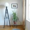 Tripod floor lamp with unique monochrome features and a glass globe shade by Fiona Bradshaw Designs