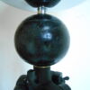 Tripod floor lamp with unique monochrome features and a glass globe shade by Fiona Bradshaw Designs