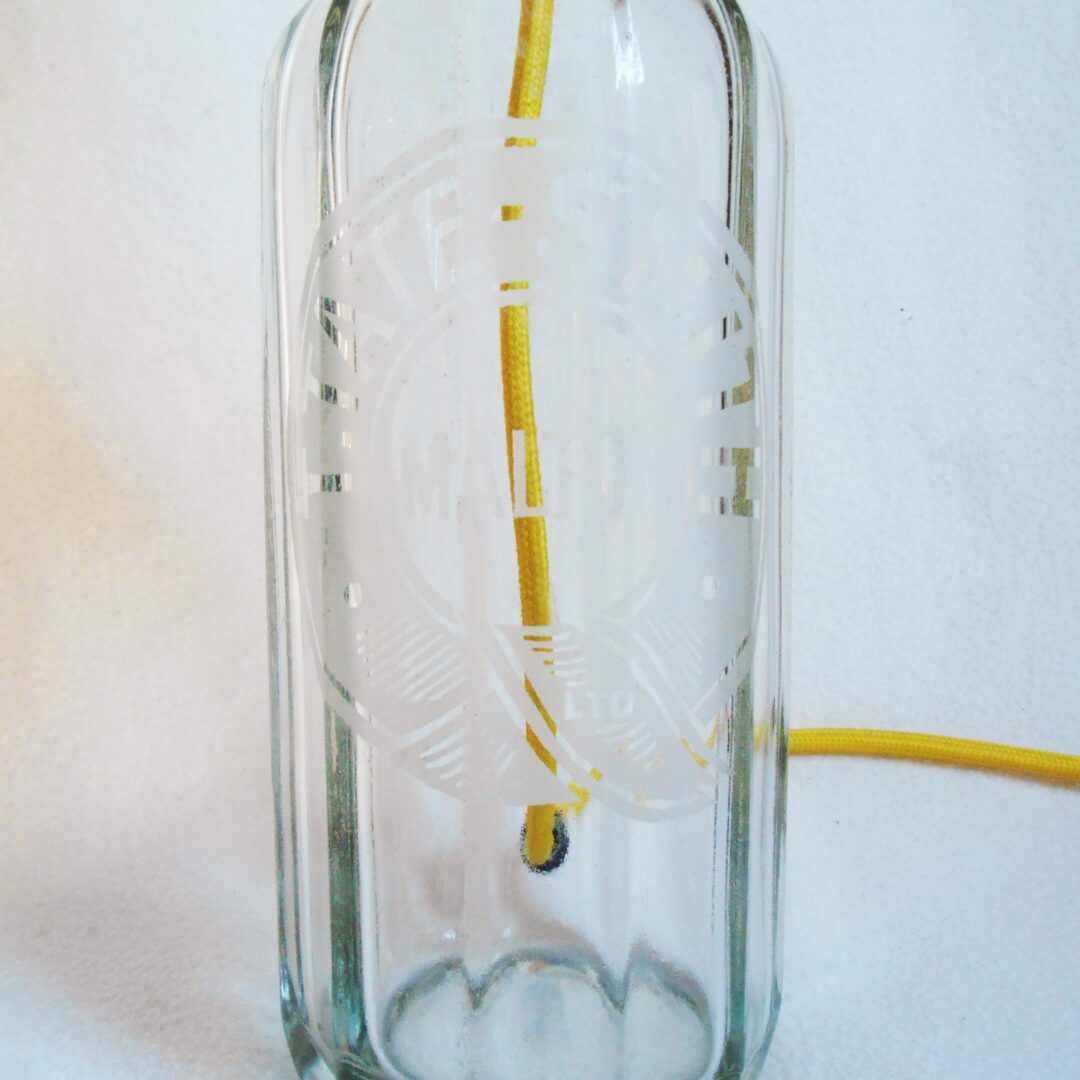Vintage soda syphon lamp with a yellow braided cable by Fiona Bradshaw Designs