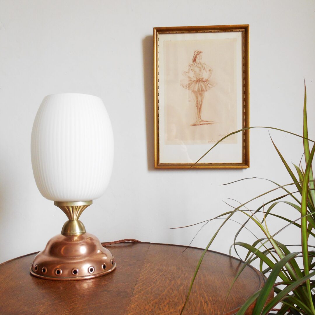 Copper dolly plunger lamp with an oval opaline shade by Fiona Bradshaw Designs