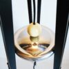 Tripod floor lamp with unique monochrome features and a glass globe shade by Fiona Bradshaw Designs
