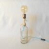A vintage soda syphon repurposed into a unique table lamp by Fiona Bradshaw Designs