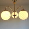 Art Deco style brass chandelier with three glass globe shades by Fiona Bradshaw Designs