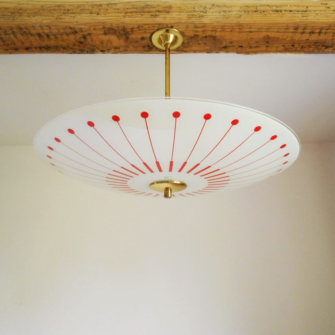 Retro glass pendant lamp with a red and white geometric pattern by Fiona Bradshaw Designs