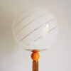 A vintage octagonal oak floor lamp with a glass domed shade by Fiona Bradshaw Designs