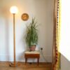 A vintage octagonal oak floor lamp with a glass domed shade by Fiona Bradshaw Designs