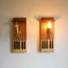 A pair of repurposed wall lamps with antique piano keys by Fiona Bradshaw Designs