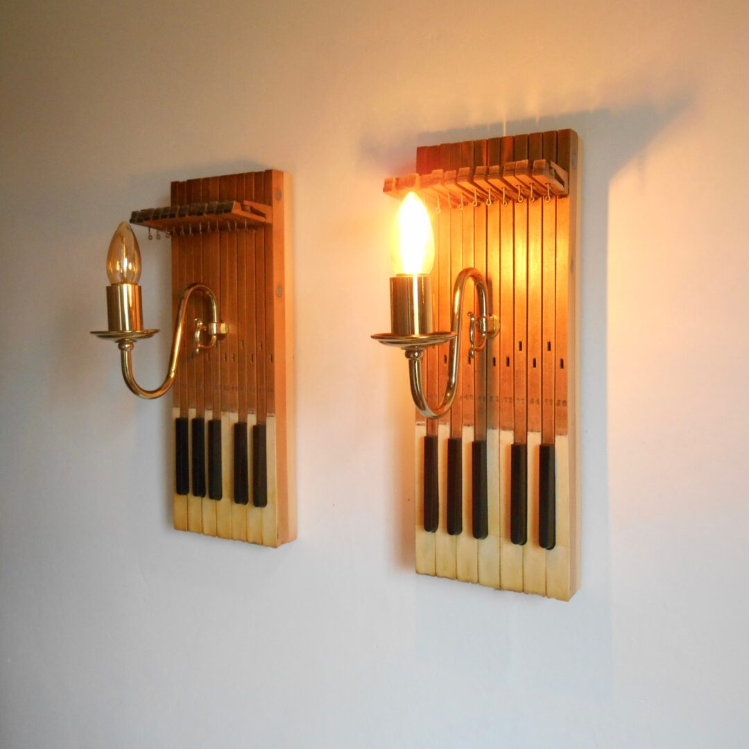 A pair of repurposed wall lamps with antique piano keys by Fiona Bradshaw Designs