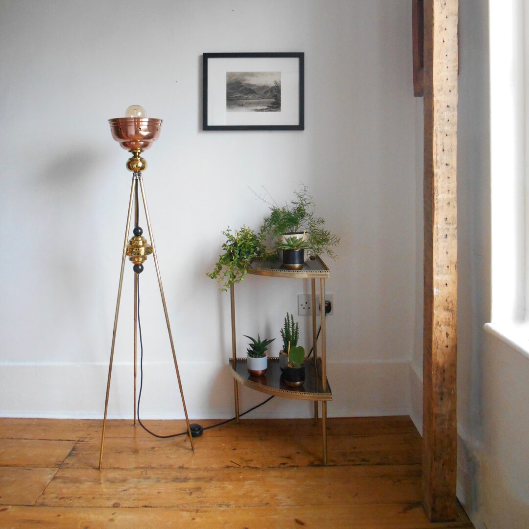 An antique brass tripod floor lamp by Fiona Bradshaw Designs