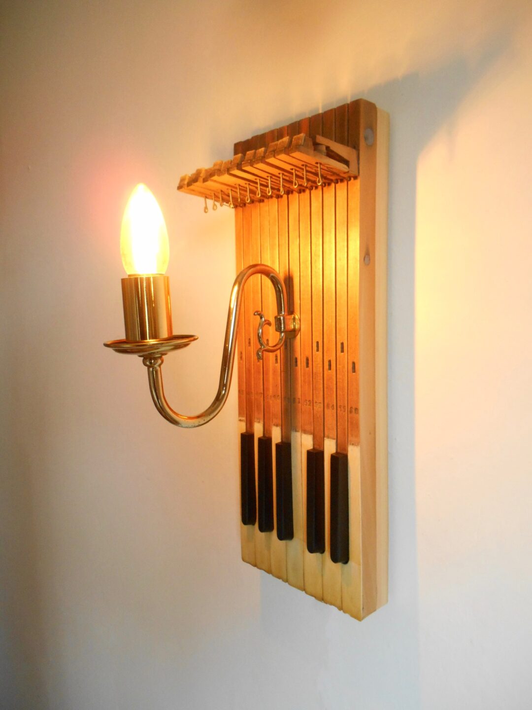Repurposed wall lamp with antique piano keys by Fiona Bradshaw Designs