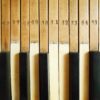 A pair of repurposed wall lamps with antique piano keys by Fiona Bradshaw Designs