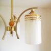 An Art Deco style unique chandelier with three cylindrical shades by Fiona Bradshaw Designs