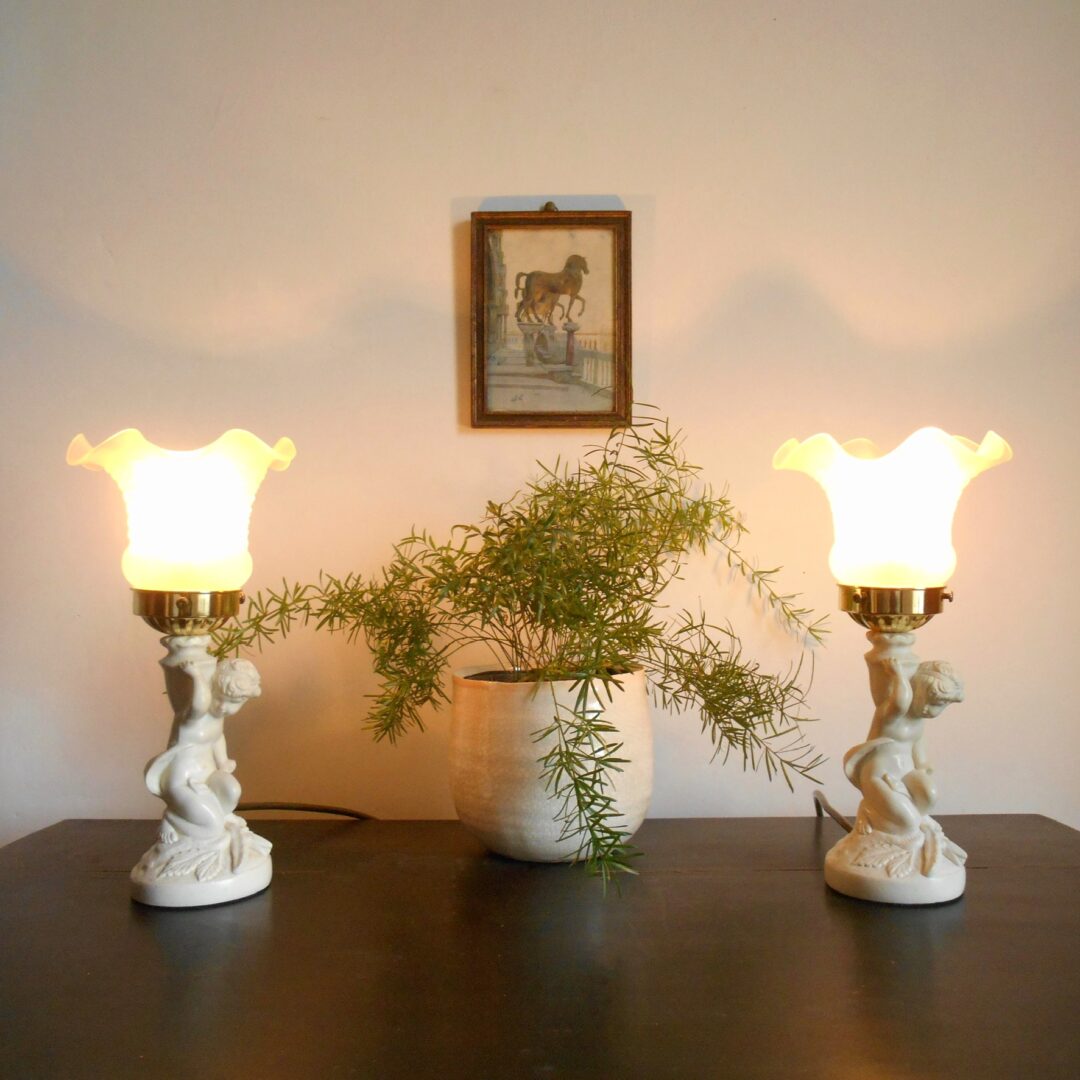 A pair of antique figurine bedside lamps by Fiona Bradshaw Designs