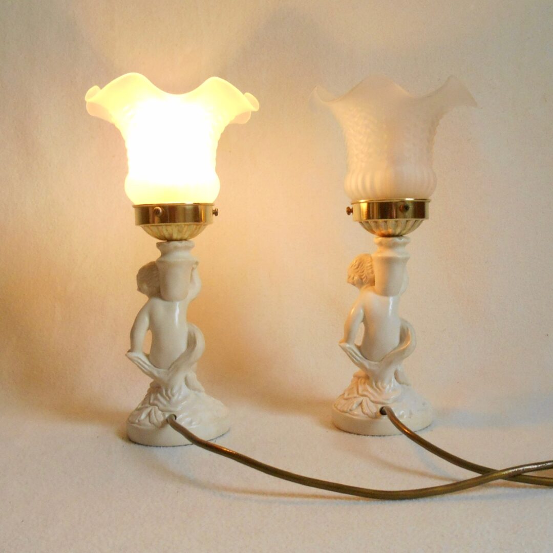 A pair of antique figurine bedside lamps by Fiona Bradshaw Designs