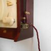 A vintage record player repurposed into a unique wall lamp by Fiona Bradshaw Designs