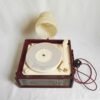 A vintage record player repurposed into a unique wall lamp by Fiona Bradshaw Designs