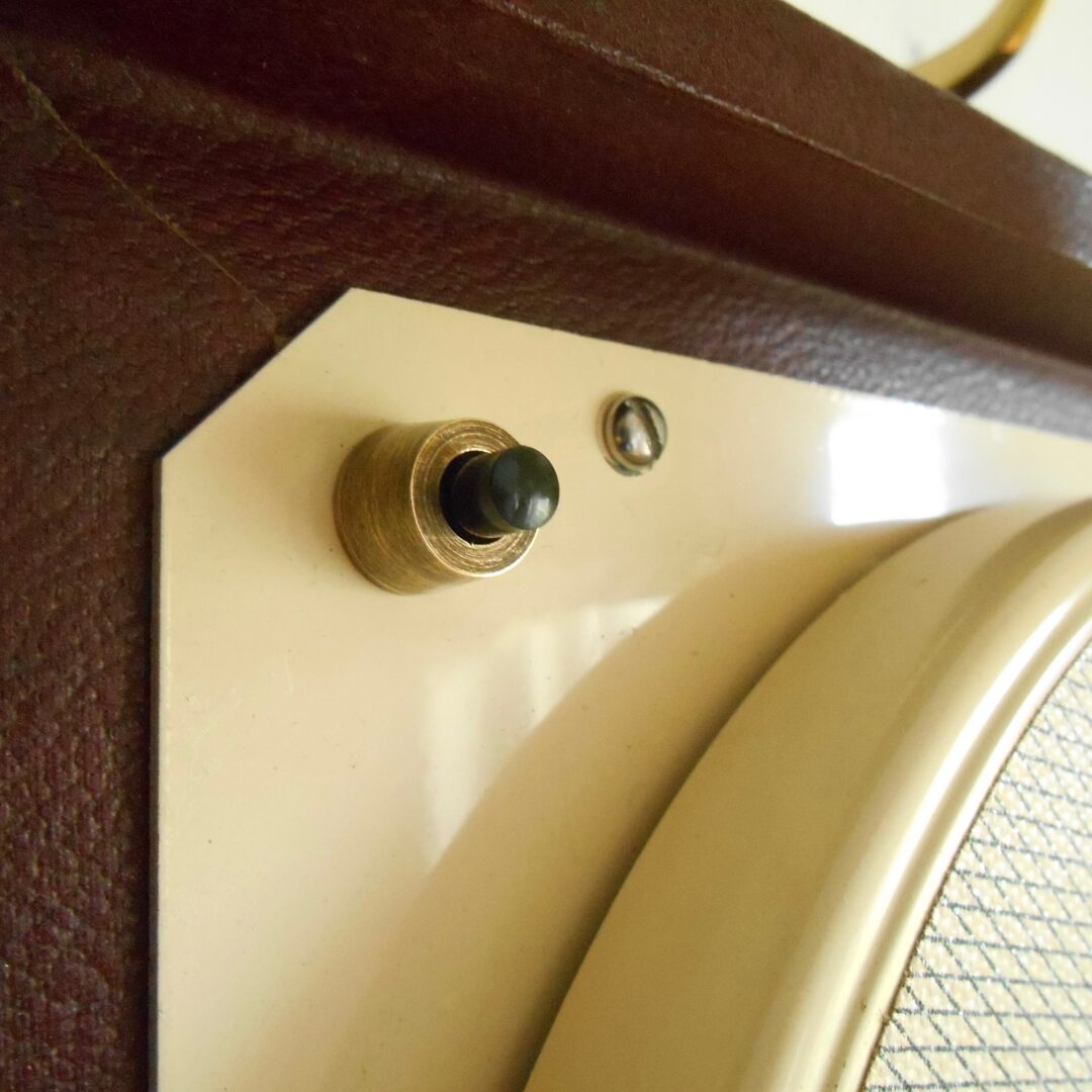 A vintage record player repurposed into a unique wall lamp by Fiona Bradshaw Designs