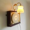 A vintage record player repurposed into a unique wall lamp by Fiona Bradshaw Designs