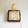 A vintage record player repurposed into a unique wall lamp by Fiona Bradshaw Designs