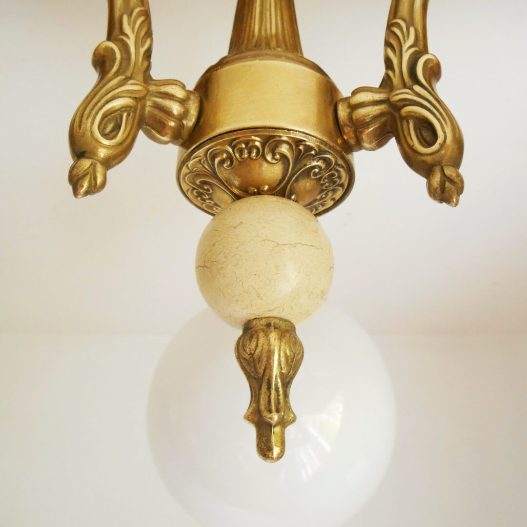 A solid brass Art Deco chandelier with three glass globe shades by Fiona Bradshaw Designs