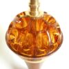A vintage teak and amber tall table lamp by Fiona Bradshaw Designs