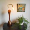 A vintage teak and amber tall table lamp by Fiona Bradshaw Designs