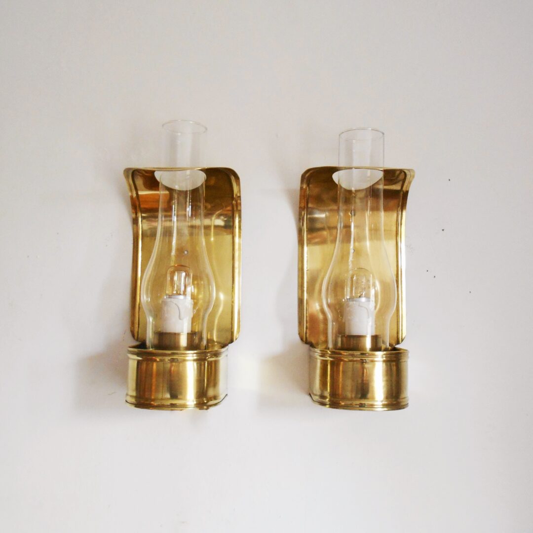 A pair of curved brass vintage wall lamps by Fiona Bradshaw Designs