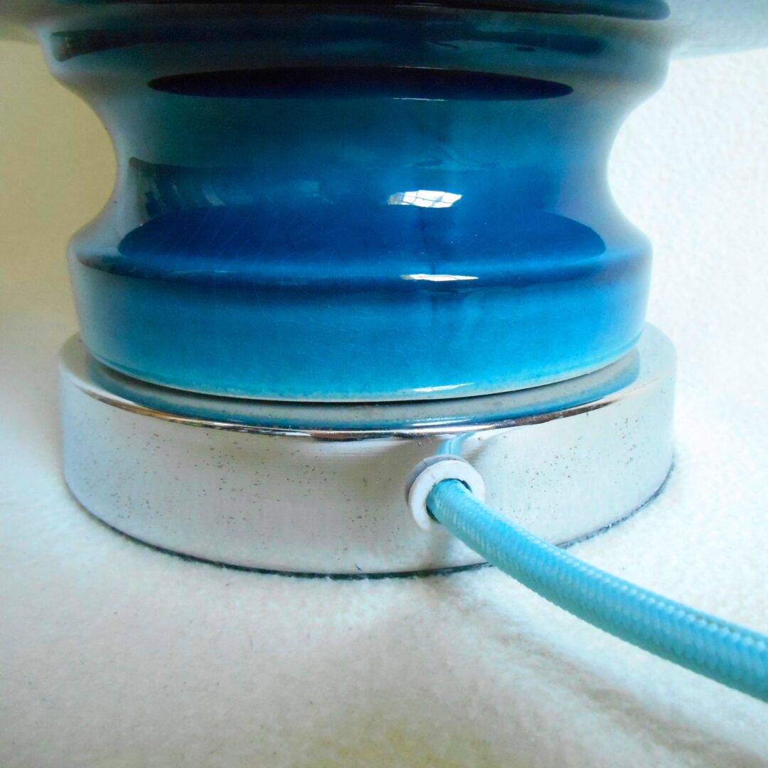 A blue ceramic table lamp with a vintage cut glass shade by Fiona Bradshaw Designs