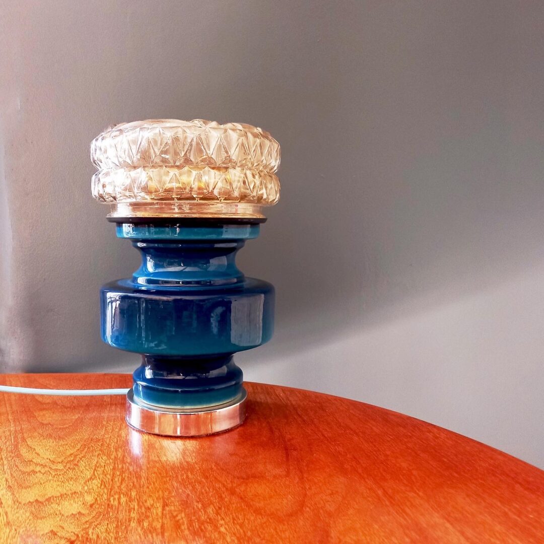 A blue ceramic table lamp with a vintage cut glass shade by Fiona Bradshaw Designs
