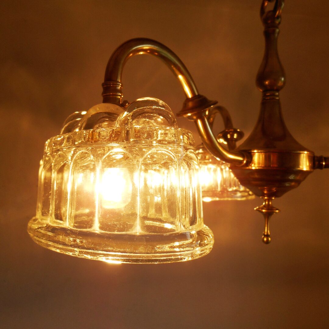 Brass chandelier with jelly mould shades by Fiona Bradshaw Designs