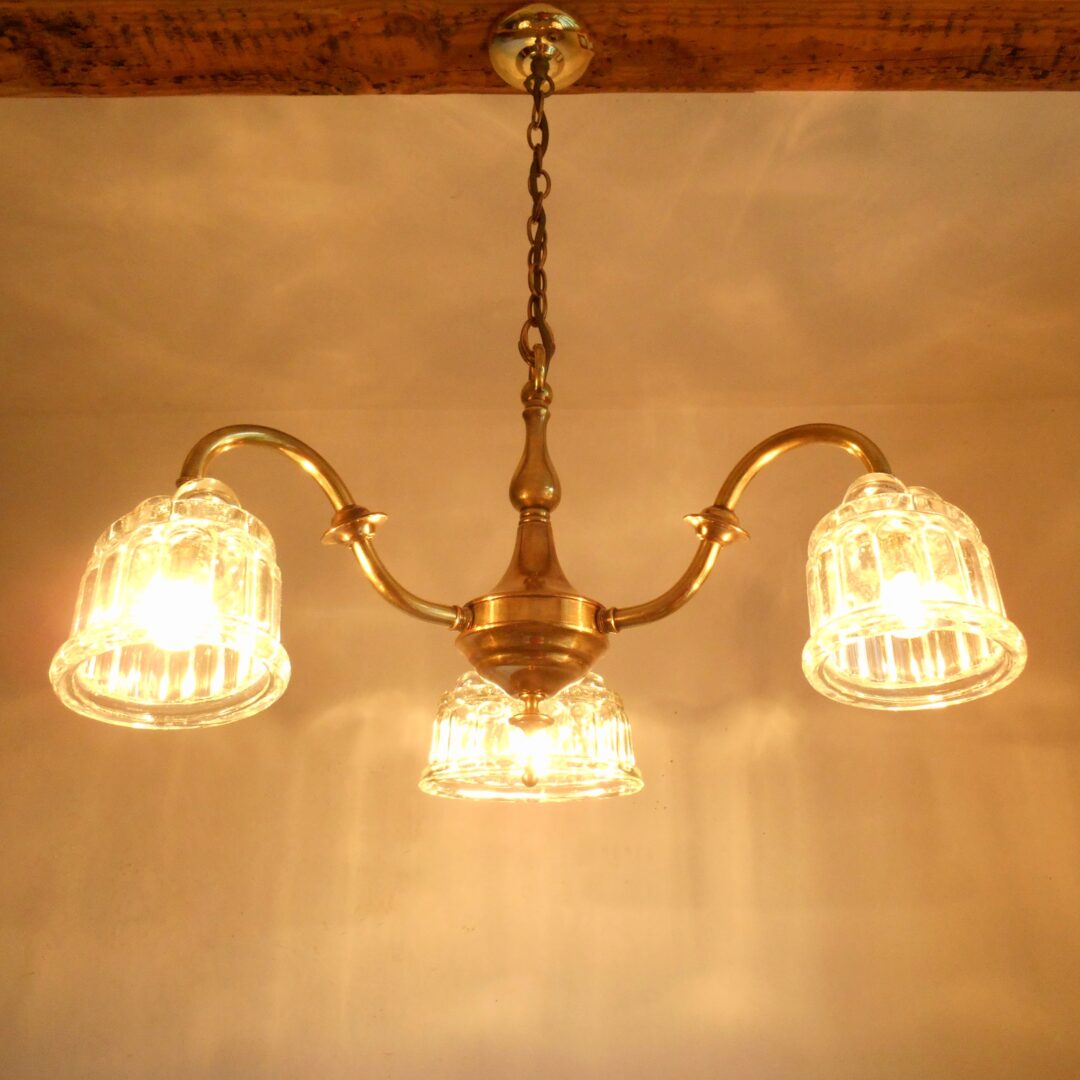 Brass chandelier with jelly mould shades by Fiona Bradshaw Designs